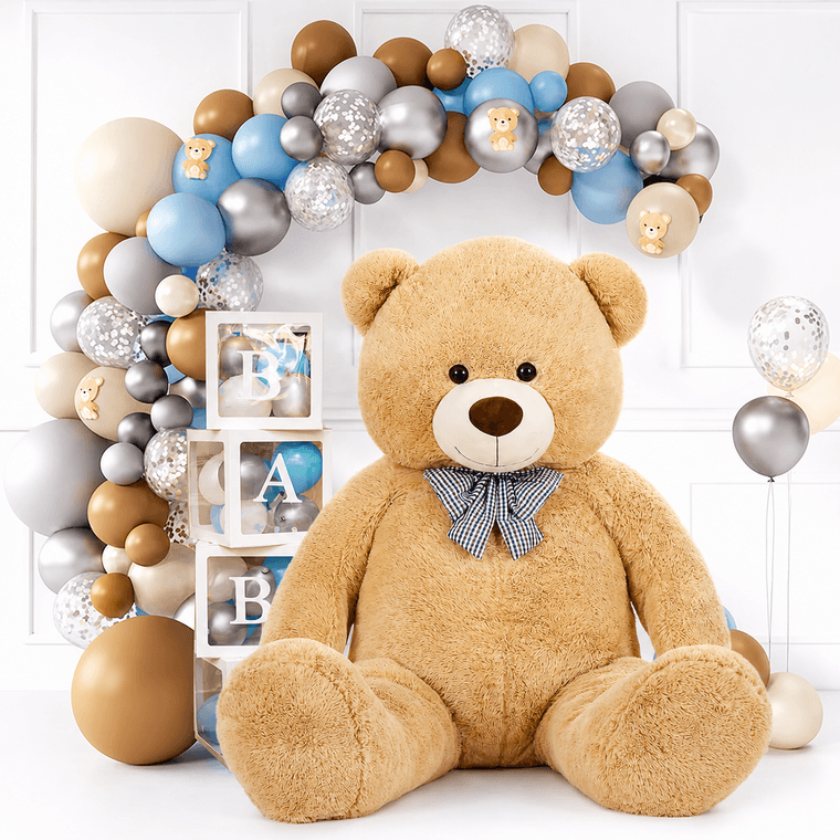 Large beige teddy bear in a bright balloon celebration setting